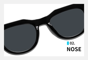 Detail view of the sleek integrated nose pads and modern black resin bridge of the sunglasses