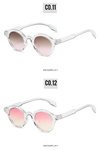 Detail view of round retro sunglasses showing pink-brown and pink-yellow gradient lenses