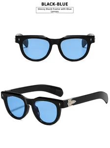 Detail view of square black sunglasses with blue lenses and silver arrow metal accents