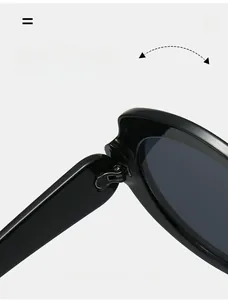 Close-up of the durable metal hinge on these futuristic black wrap-around sunglasses