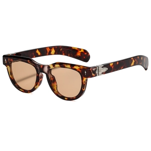 Retro tortoise shell sunglasses with amber texture and silver metal arrow rivets