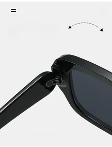 Detailed macro view of durable reinforced metal hinge on black polished sunglasses
