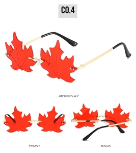 Three-angle views of maple leaf-shaped rimless sunglasses with red lenses and gold legs