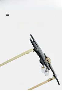Detail showing the serrated maple leaf lens edge and flexible gold metal temples of these sunglasses