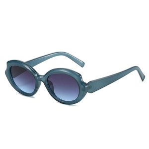 Futuristic teal transparent cat-eye sunglasses with purple gradient lenses in 45-degree view