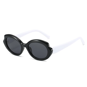 Futuristic wave frame sunglasses with black and white contrast and dark lenses