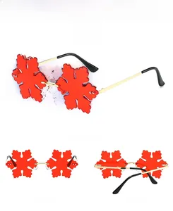 Three-way view of red snowflake party sunglasses with gold metal frame for festivals