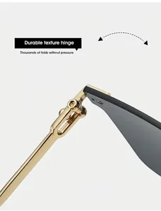Close-up of durable gold metal hinges on rimless cat-eye sunglasses for women