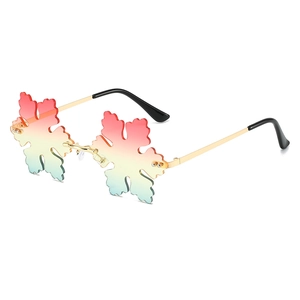 Unique snowflake shaped rimless sunglasses with pink to blue gradient lenses and gold frame