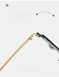 Gros plan sur la charnière dorée de la monture noire des lunettes de soleil étoile