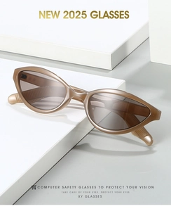 Detail of amber cat-eye computer glasses with translucent frames on geometric blocks