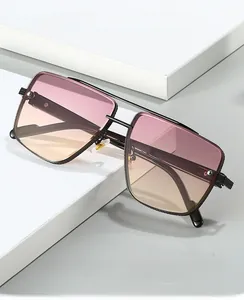 Detail of square gradient sunglasses with double bridge metal frame on a white display