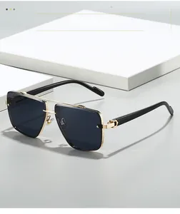 Close-up of golden aviator sunglasses with unique textured metal frames and dark lenses