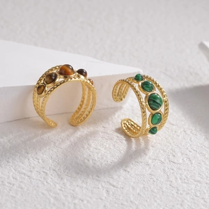 Adjustable gold plated rings featuring natural malachite and tiger eye gemstones
