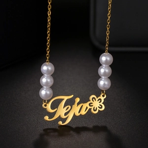 Custom Teja name necklace in gold with flower design and elegant white pearls