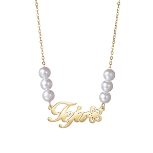 Custom Teja name necklace in gold with flower charm and elegant white pearl accents