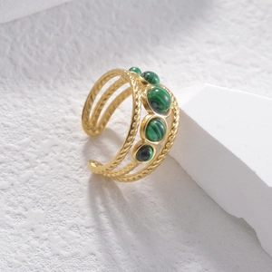 Three-layer twisted gold open ring with five round green malachite stones on stone base
