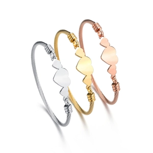 Three-piece heart charm cable bracelets in gold, silver, and rose gold stainless steel