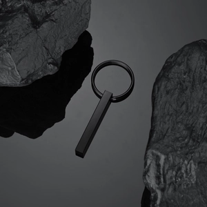 Minimalist matte black 304 stainless steel geometric bar keychain with industrial design