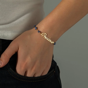 Golden stainless steel Precious letter bracelet with blue evil eye charm for women