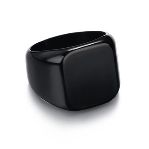 Close-up of minimalist black square signet ring in polished stainless steel finish