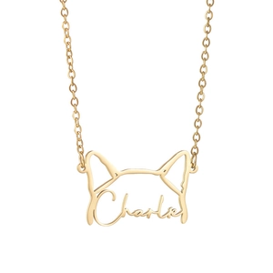 Detail view of a gold-plated stainless steel Charlie dog nameplate necklace with pet outline