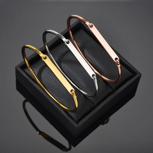 Polished minimalist geometric cuff bracelets in gold, silver, and rose gold finishes
