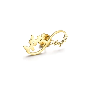 Detail of custom gold infinity brooch with butterflies and Augusta name lettering