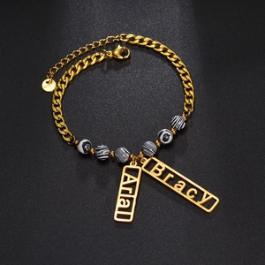 Golden stainless steel custom name bracelet with black-white beads and double tags