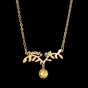 Collier en acier doré avec pendentif bois de cerf, lettrage Beauty Bee et cristal jaune