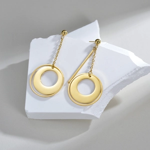 Minimalist geometric circle drop earrings in gold plated stainless steel on stone