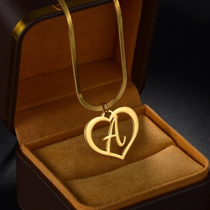 Elegant gold snake chain necklace with heart frame and letter A pendant in a gift box