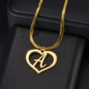 Golden heart pendant necklace with initial A on a sleek flat herringbone chain