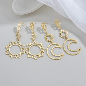 Close-up of vintage celestial sun and moon hollow earrings in 18K gold plated finish