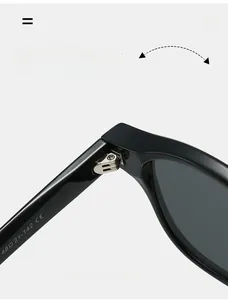 Close-up of durable metal hinge on black glossy sunglasses with CE certification mark