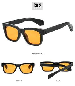 Detail view of square polarized sunglasses with black frames and vibrant orange lenses