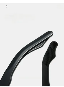 Close-up of black cat-eye sunglasses featuring curved legs and anti-slip wave texture