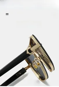 Detail of high-end sunglasses showing the lightweight C-shape hinge and golden metal frame