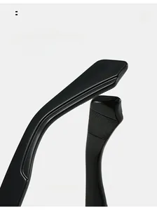 Macro detail of ergonomic curved eyeglass temples with anti-slip texture on black frame