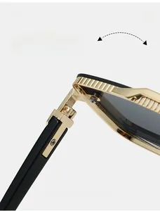 Macro view of durable gold metal hinge with anti-slip texture on black sunglasses