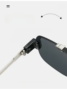 Macro shot of durable silver metal hinges and sleek grey lenses on semi-rimless sunglasses