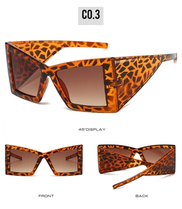 Detailed views of oversized tortoise shell cat-eye sunglasses with gradient brown lenses