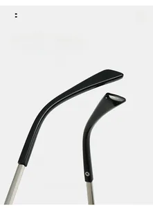 Detail of curved silver metal temples with black acetate tips on square sunglasses