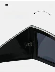 Detailed close-up of the durable silver metal hinge on these black cat-eye sunglasses