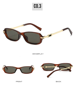 Detail view of vintage narrow rectangle sunglasses with gold metal temples and brown frames