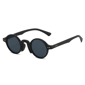 Retro round frame sunglasses with black matte finish and gold rivet details in profile view