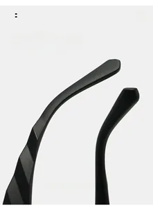 Detail of curved matte black temples with geometric cut for modern sunglasses