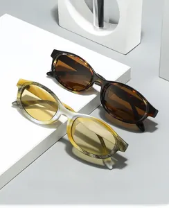 Detail view of oval blue light blocking glasses in tortoiseshell and marble patterns