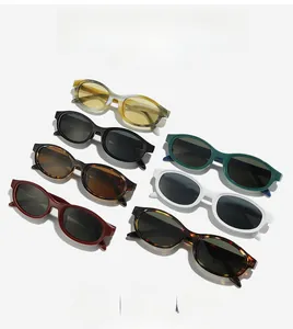 Flat lay of retro oval sunglasses in various colors like tortoise and emerald green