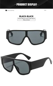 Front and side views of oversized glossy black wrap sunglasses with dark gray lenses
